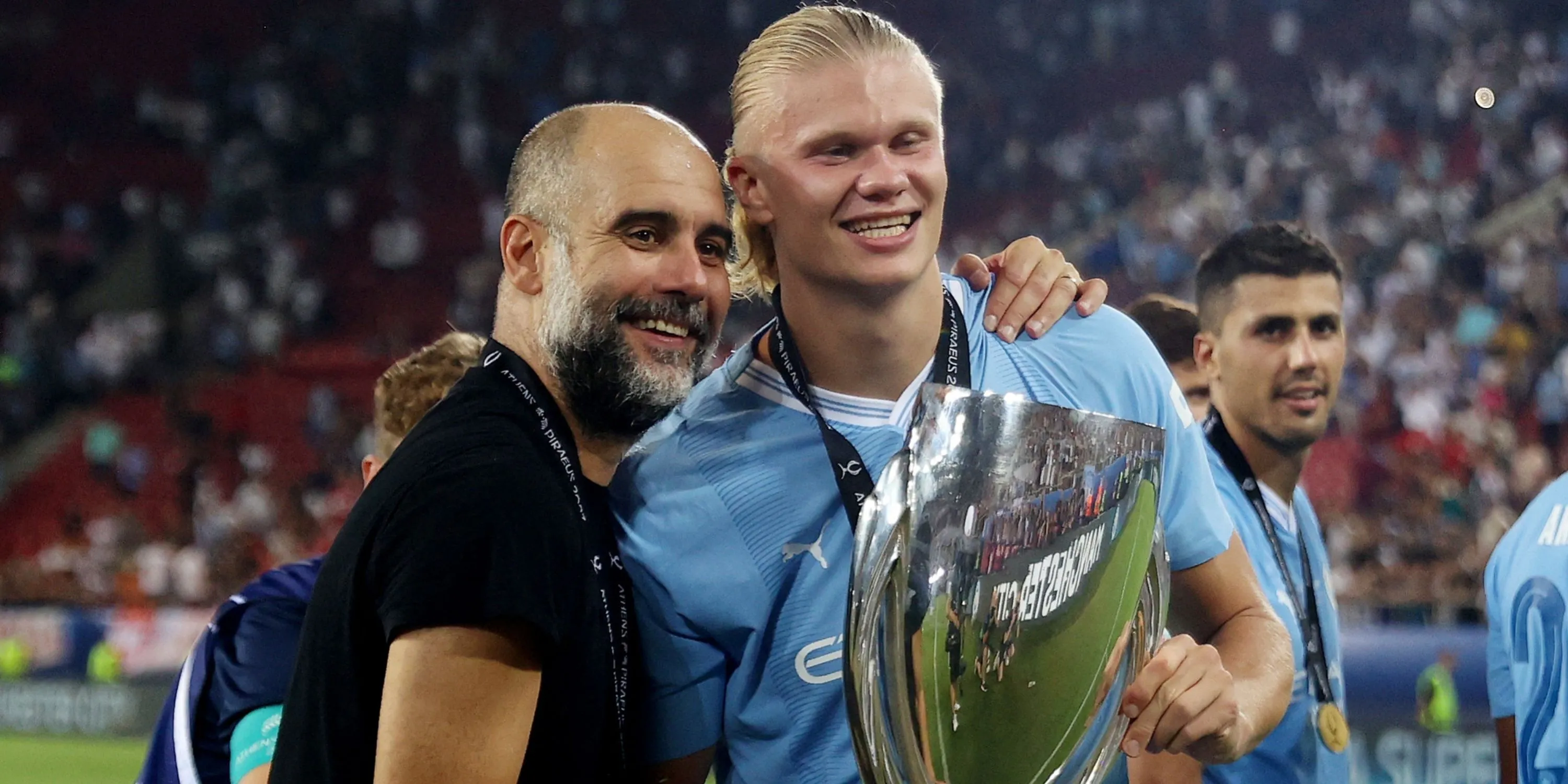 HLV Pep Guardiola và tiền đạo Erling Haaland của Manchester City.